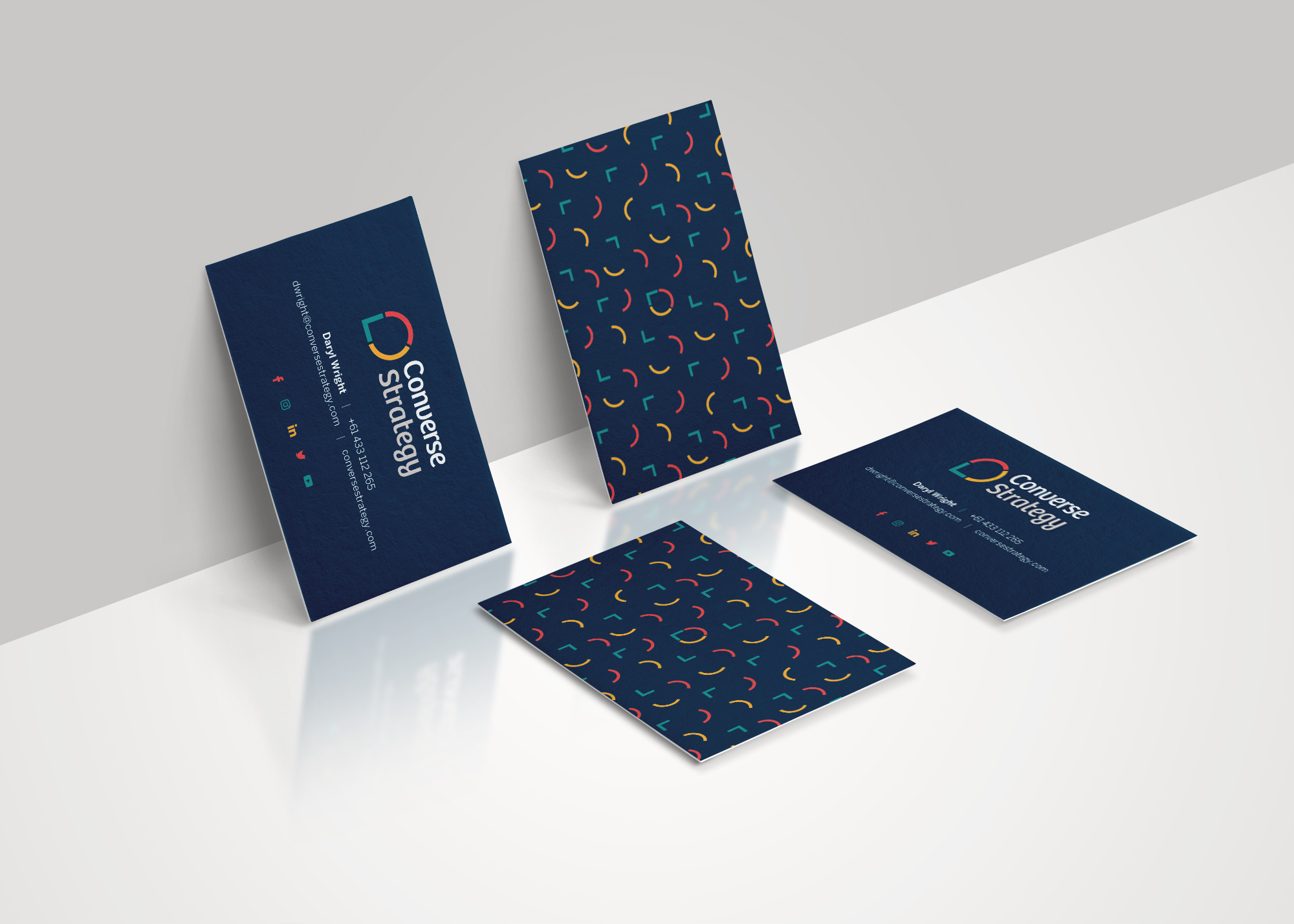 Dark blue and colourful business card designs for consulting firm, Converse Strategy, in Brisbane